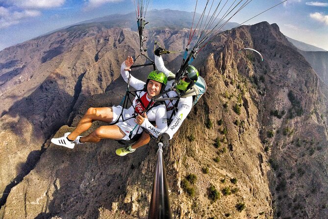 BRONZE tandem paragliding flight in South Tenerife, free pick up - Landing at La Caleta Beach: Soft Sand and Atlantic Sounds