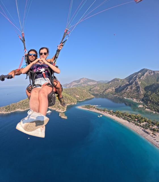 From Fethiye: Oludeniz Paragliding Trip with Transfer - Landing on the Ölüdeniz coast and getting your photos/video