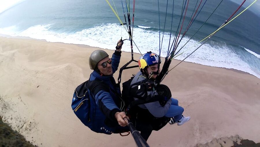 From Lisbon: Paragliding Tandem Flight - The view you came for: ocean colors and coastline shapes from above