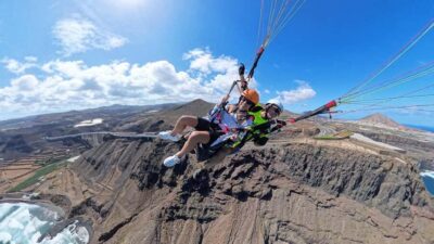 Gran Canaria: Paragliding Flight with Tapas & Pickup - The views: volcanic cliffs, turquoise bays, and Teide in the distance