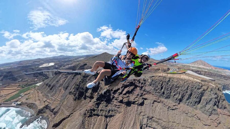 Gran Canaria: Paragliding Flight with Tapas & Pickup - The views: volcanic cliffs, turquoise bays, and Teide in the distance