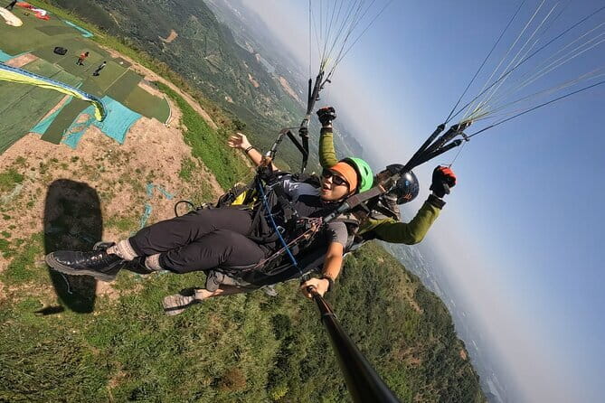 Tandem Paragliding Experience in Hanoi - Your Time in the Air: 655m Views, Two Passes, and the Pilot’s Job