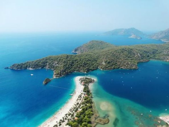 Tandem Paragliding Flight Experience Babadağ Mountain Fethiye - Getting picked up: how the air-conditioned ride shapes the day