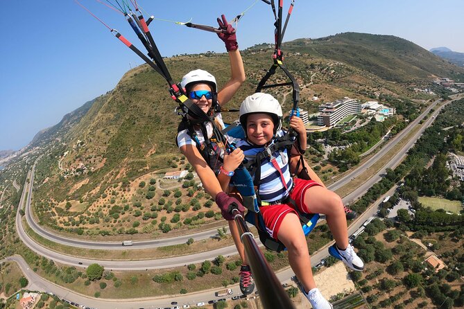 Tandem Paragliding Flight in Cefalù - GoPro, SD card, and instant downloads to your phone