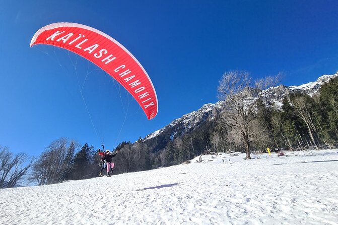 Two-seater paragliding flight in Chamonix - Safety Setup: Helmet, Harness, and an Instructor in Charge